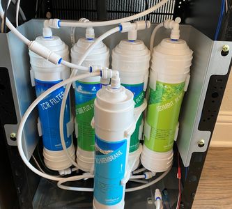 Water system dispensing purified water